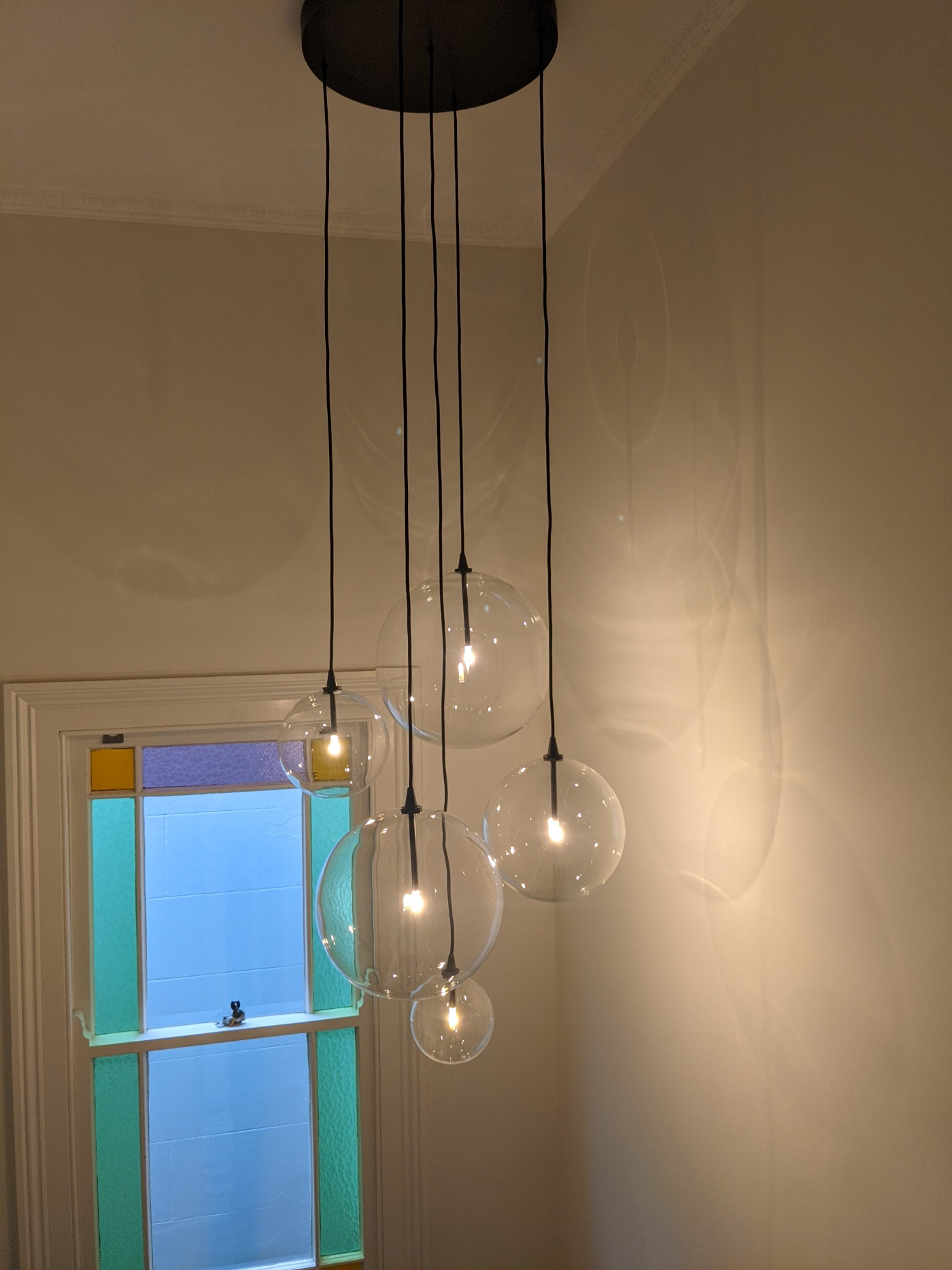Designer clear globe cluster pendant installation, Sydney home