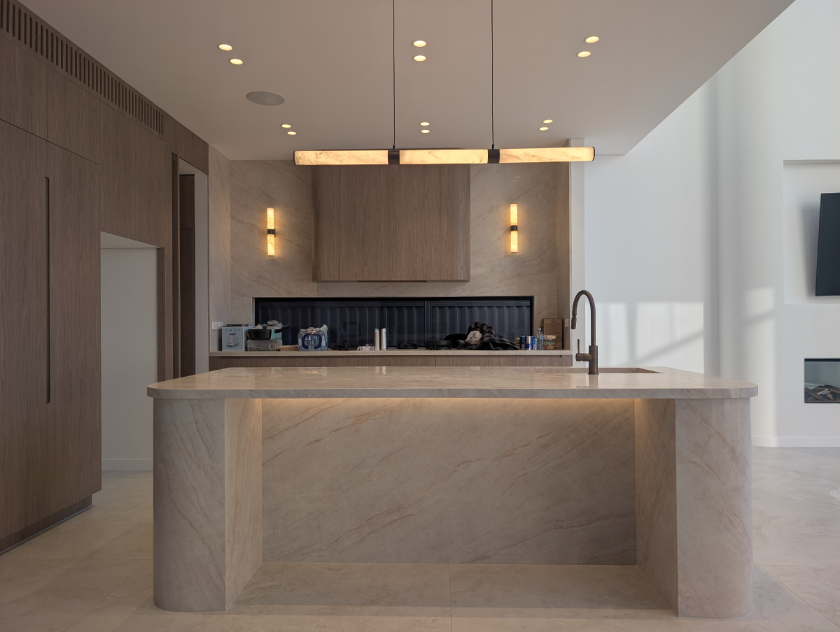 Marble kitchen with alabaster linear pendant and recessed downlights, premium Sydney home